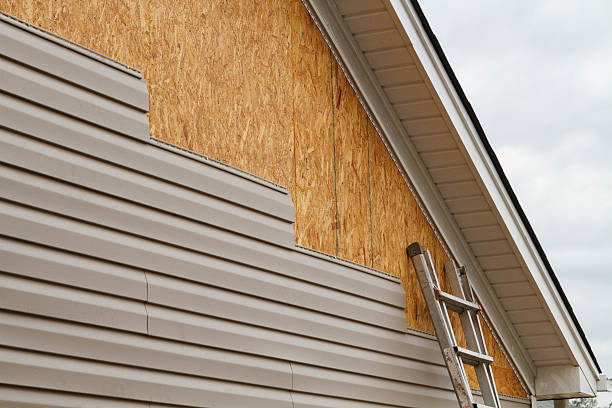 Professional Vinyl Siding technician working in North Reading, MA